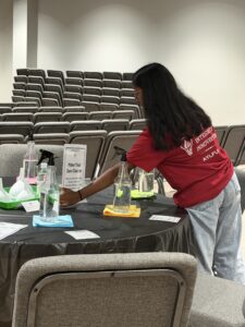 AYLUS volunteer setting up a station